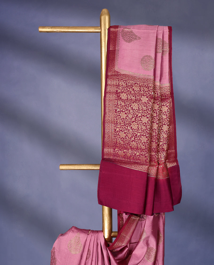 Onion Pink Colour Pure Banaras Soft Silk Saree adorned with traditional antique zari motifs, paired with a hand dyed Dark Magenta antique style border and a matching blouse.