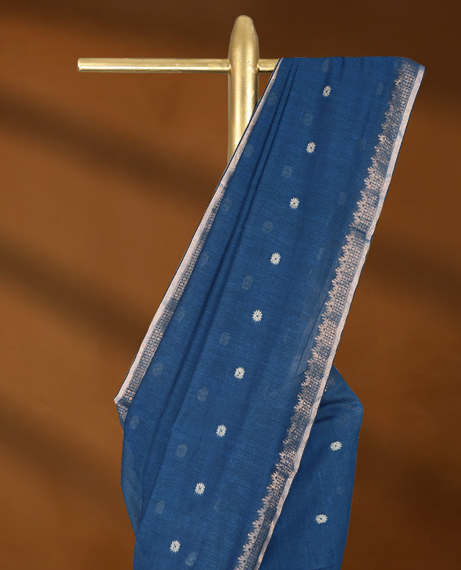 Blue colour soft khadi cotton saree with small Beige Zari Flower motifs on the body, detailed woven Gold zari border, paired pallu with tussles, with matching blouse.