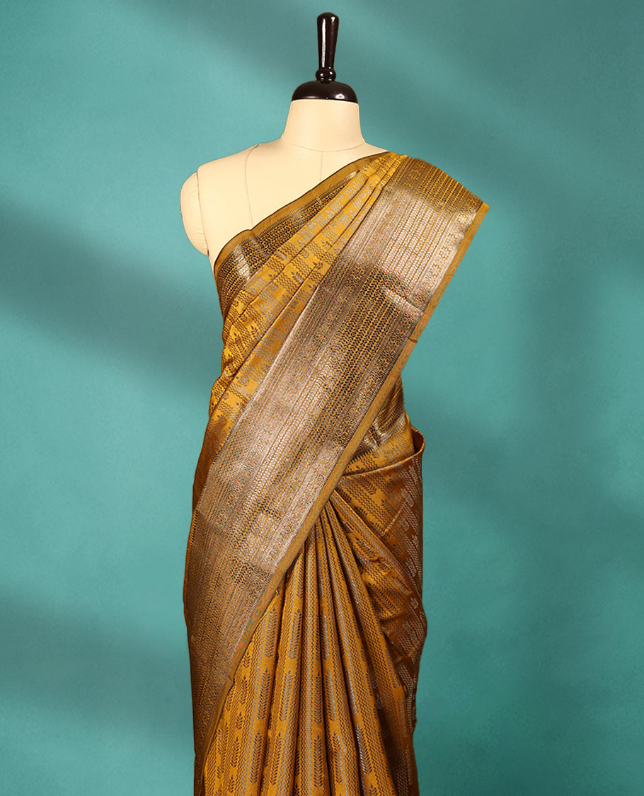 Mustard Art Soft Silk Saree showcases intricate silver zari work on the body and border, paired with a matching blouse