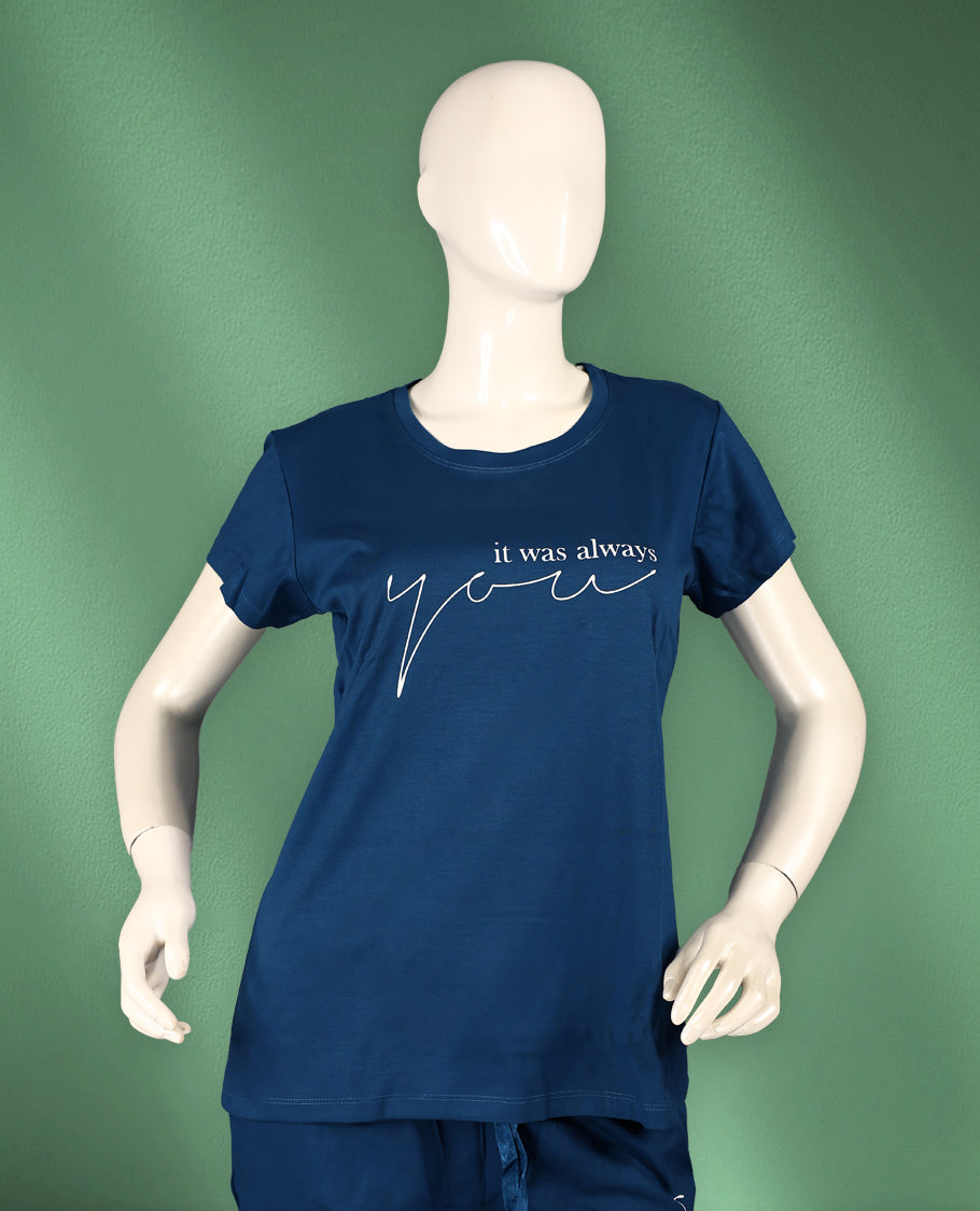 Blue colour women's nightwear set featuring a round-neck, short-sleeve top with a stylish print, paired with matching drawstring pants for a comfortable and coordinated look.