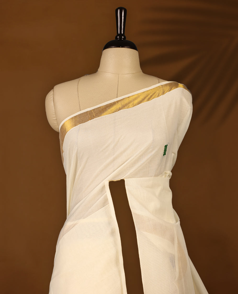 Elegant off white colour cotton Kerala saree featuring Plain body and traditional golden zari kasavu border with multi colour Double peacock Embroidery offering a classic and graceful look, paired with a matching blouse.