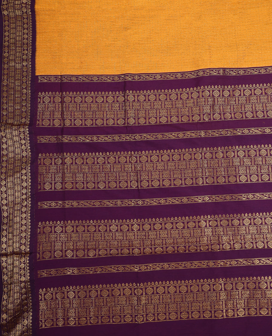 Bright Mustard colour mixed Kalyani cotton saree featuring Gold zari checks throughout the body, paired with Deep Grape colour traditional border and pallu, with matching blouse