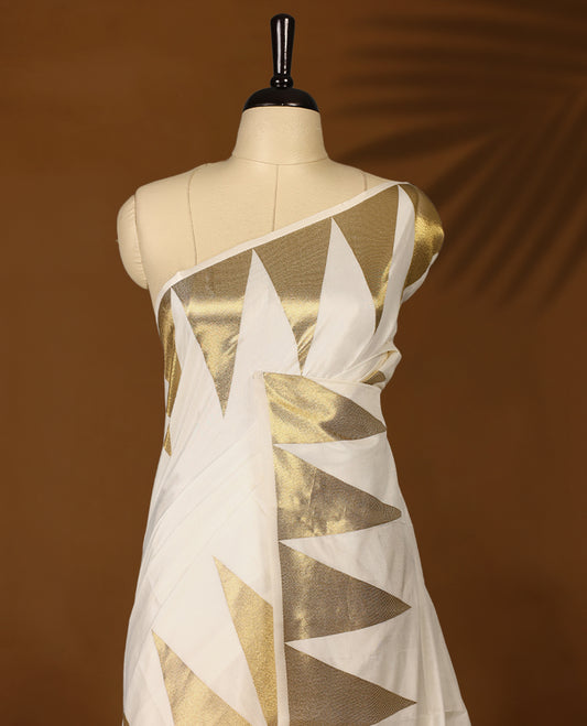Elegant white colour soft  Tussar Kerala saree featuring Plain body, Gold kasavu Temple border, Paired with matching blouse offering a classic and graceful look