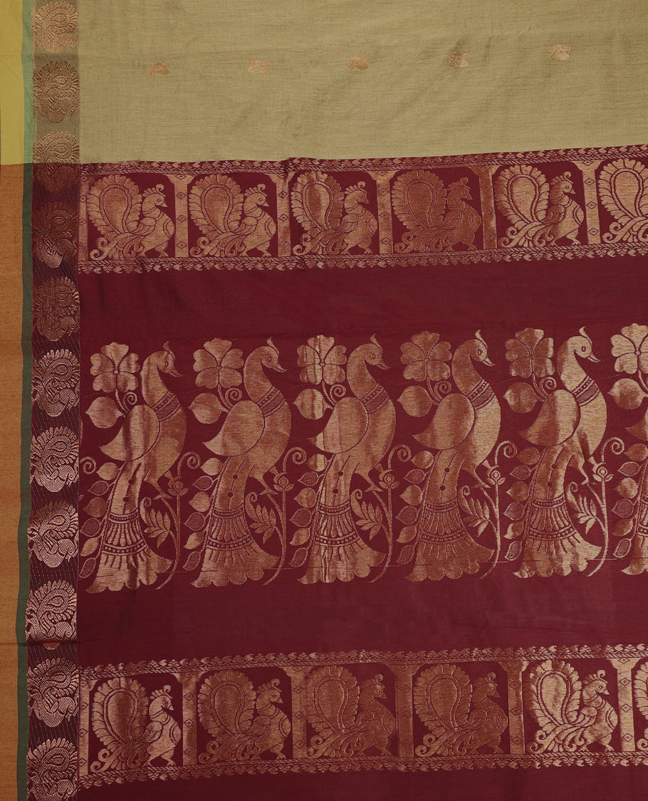 Olive Green and Maroon Kalyani cotton saree featuring subtle woven motifs on the body, accentuated with rich zari peacock designs on the border and pallu, paired with a matching blouse.