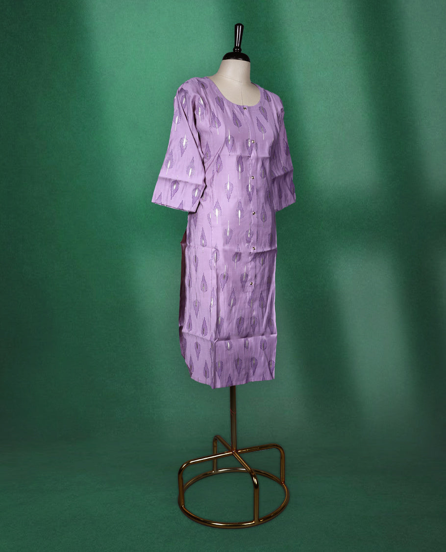 Lavender colour cotton kurti adorned with metallic silver leaf motifs, featuring a round neckline, front button placket, and elbow length sleeves a perfect blend of subtle shine and everyday comfort.