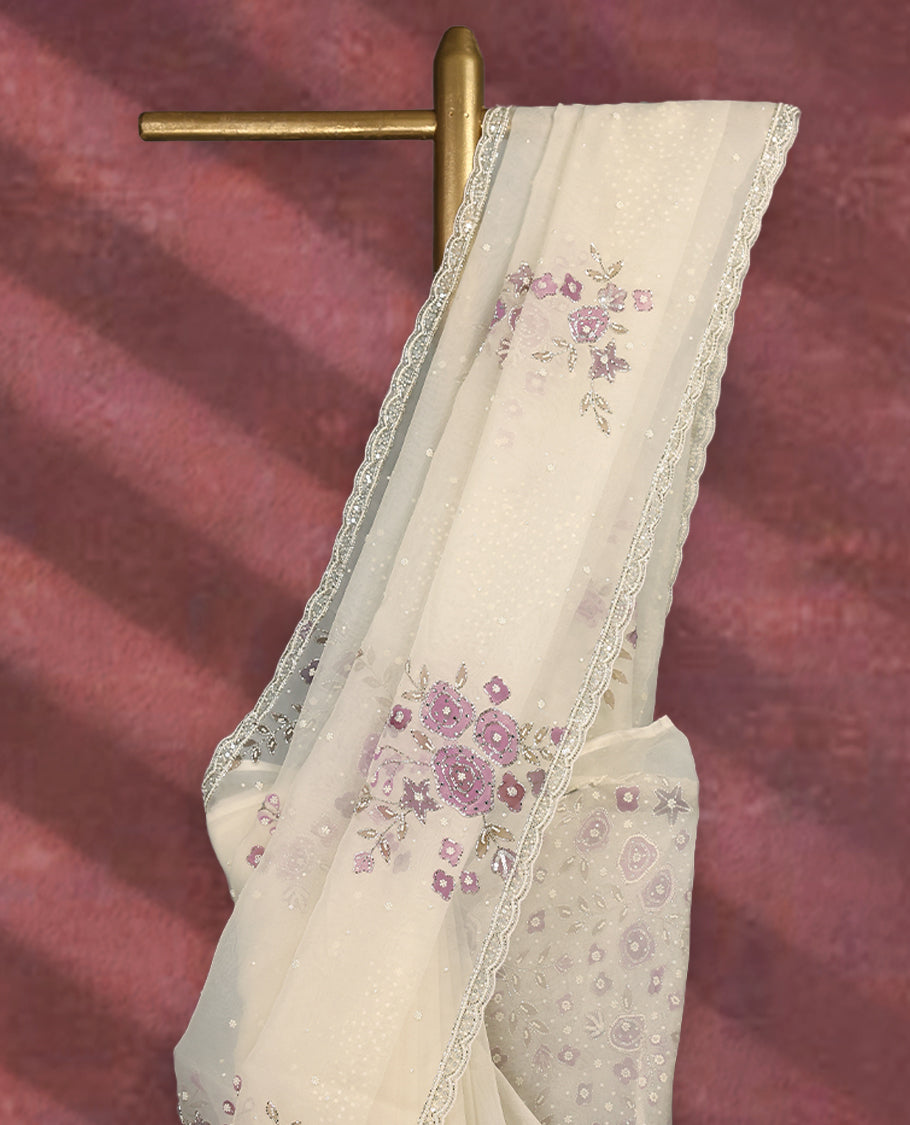 White colour pure organza saree featuring Light Purple floral prints with intricate bead and sequin work across the body, adorned with a matching embellished border, complemented by a worked pallu and paired with a heavily worked matching blouse.