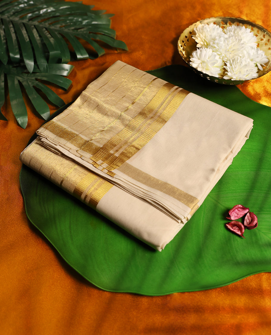 Elegant off white colour cotton double dhoti highlighted with a broad golden zari border, crafted for a royal traditional look, perfect for festive occasions and cultural ceremonies.