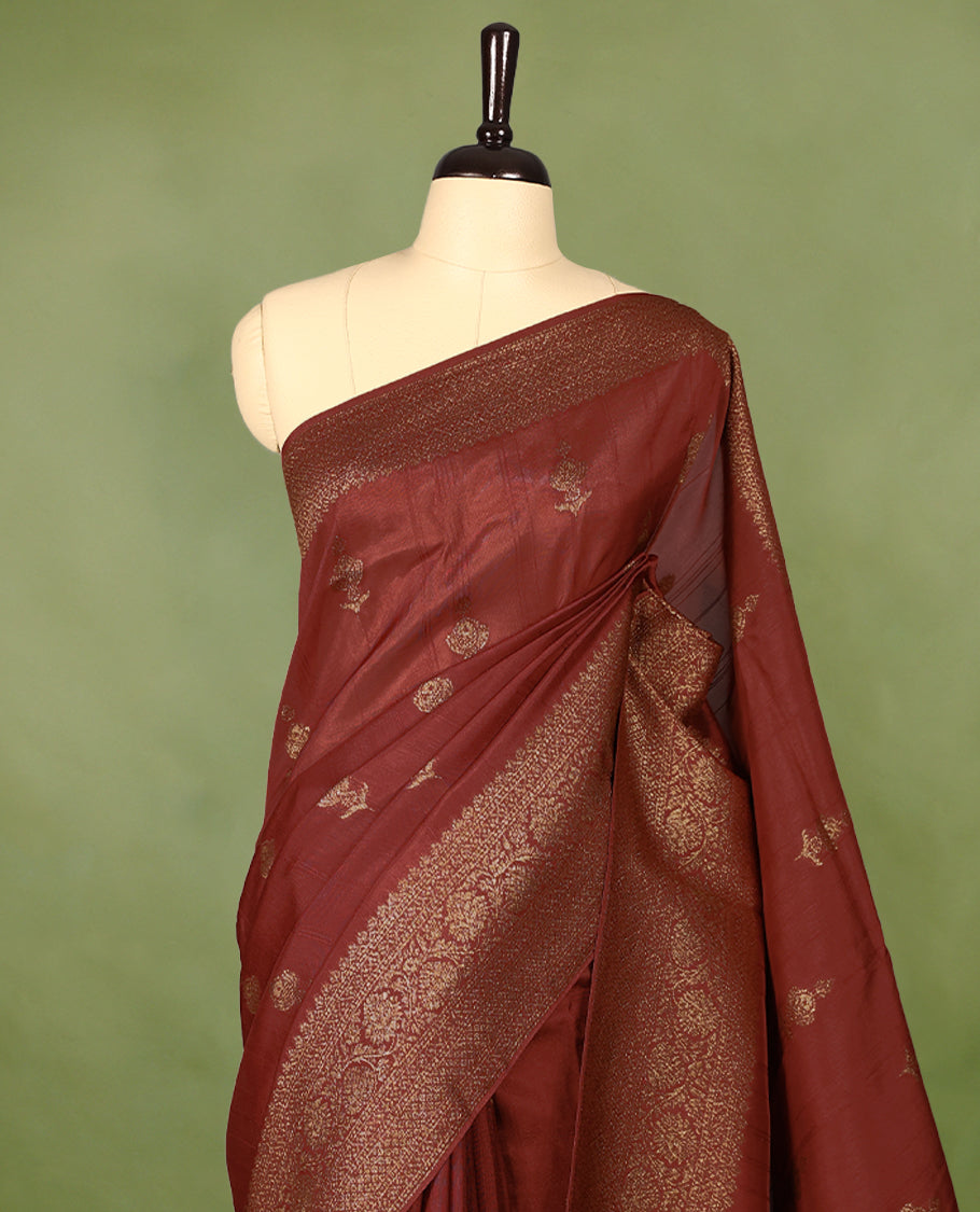 Rust Orange semi-Banaras tussar georgette saree embellished with antique zari motifs across the body, complemented by a rich heritage Banaras border and paired with a matching blouse.