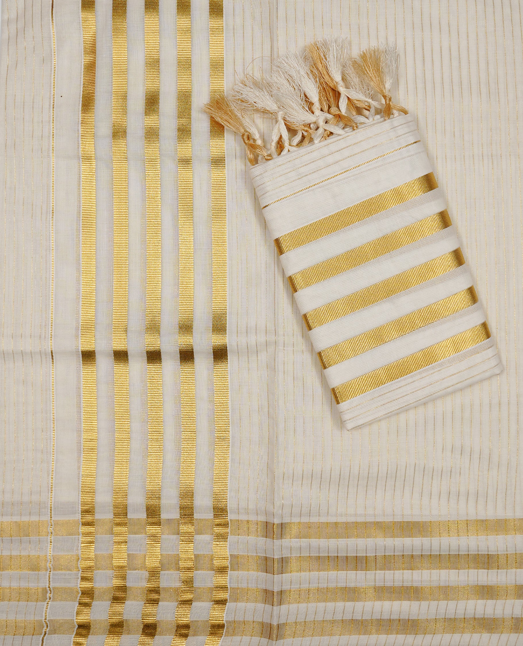 Off white colour Cotton Set Mund featuring a Striped body, enhanced by a Traditional zari border.