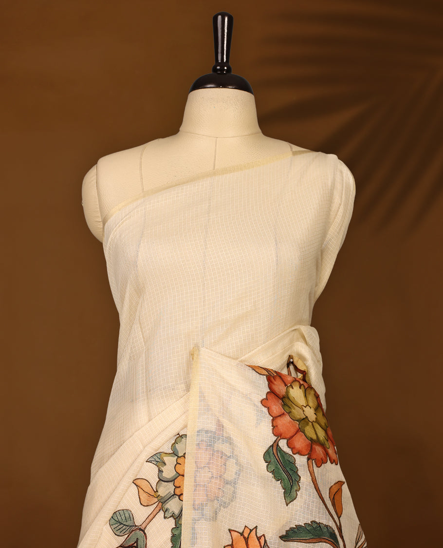 Graceful off white Kota net saree adorned with vibrant hand painted floral motifs on the pallu, blending subtle elegance with artistic charm & A perfect pick for festive gatherings and cultural occasions.