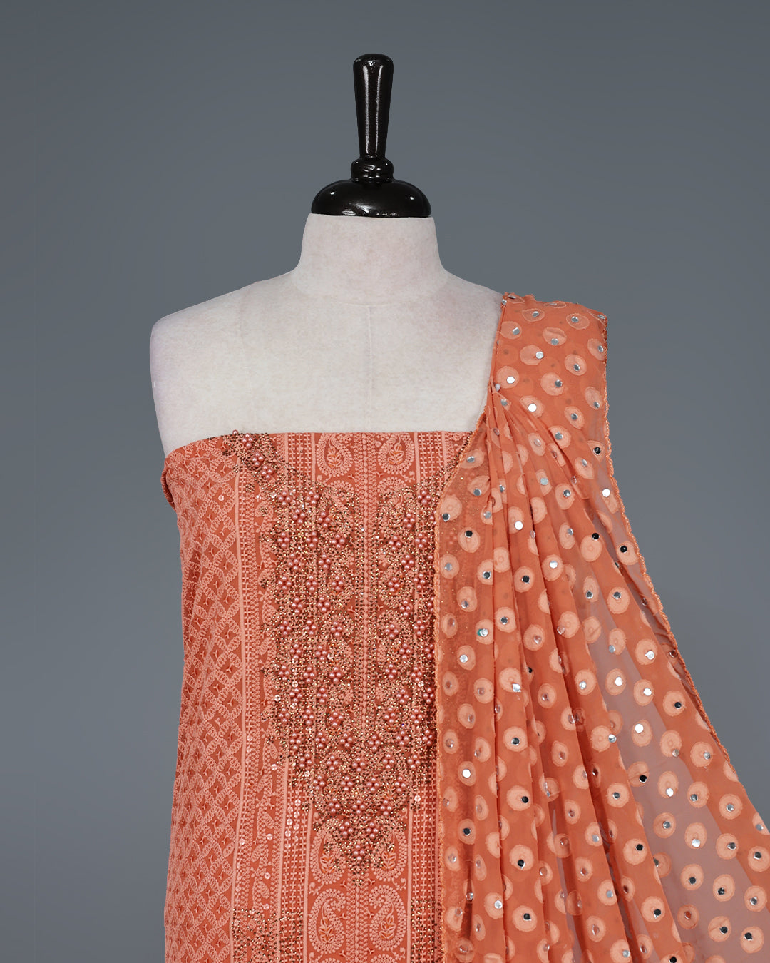 Coral Colour Georgette Salwar Material featuring elegant Chikankari Work on the kurta, paired with a matching bottom and a stunning sequin-embellished dupatta for a graceful festive look.