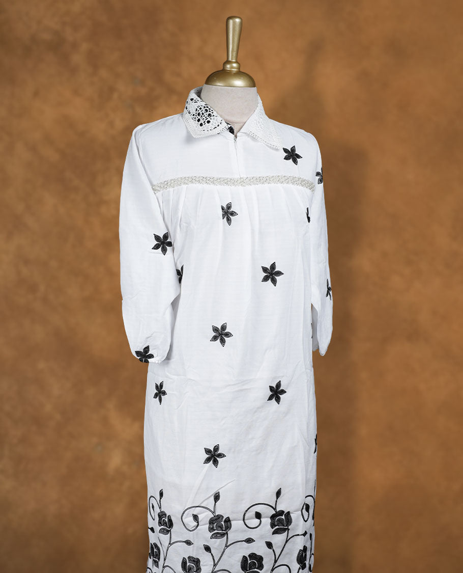 White embroidered nightwear kurti with contrast black floral motifs, crochet-detailed shirt collar, front yoke gathers, and three-quarter sleeves with elasticated hem