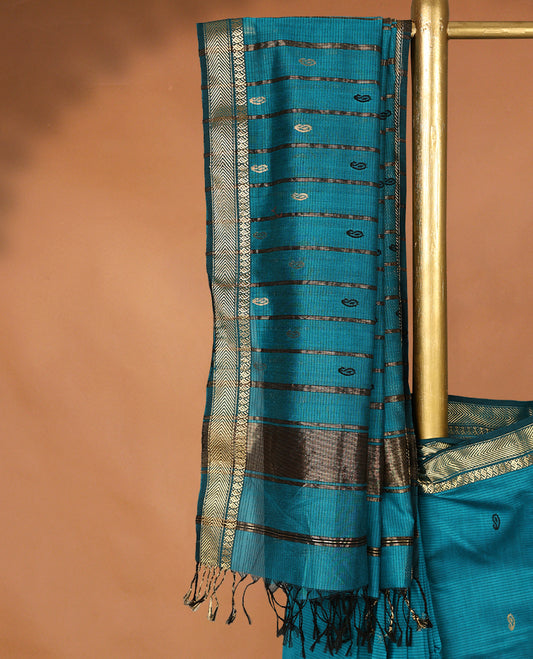 Peacock Blue colour Maheshwari Cotton saree featuring Antique Zari Mango Patterns across the entire body, complemented by a traditional Gold Zari border & Pallu, with a contrast blouse.