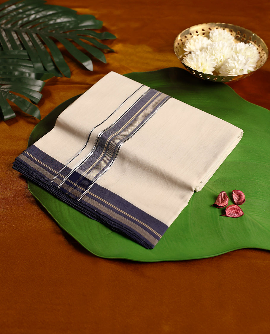 Off white colour pure handloom double dhoti featuring an elegant navy blue kara with golden zari stripes and fine line detailing, woven with precision for comfort and durability, perfect for traditional and festive occasions