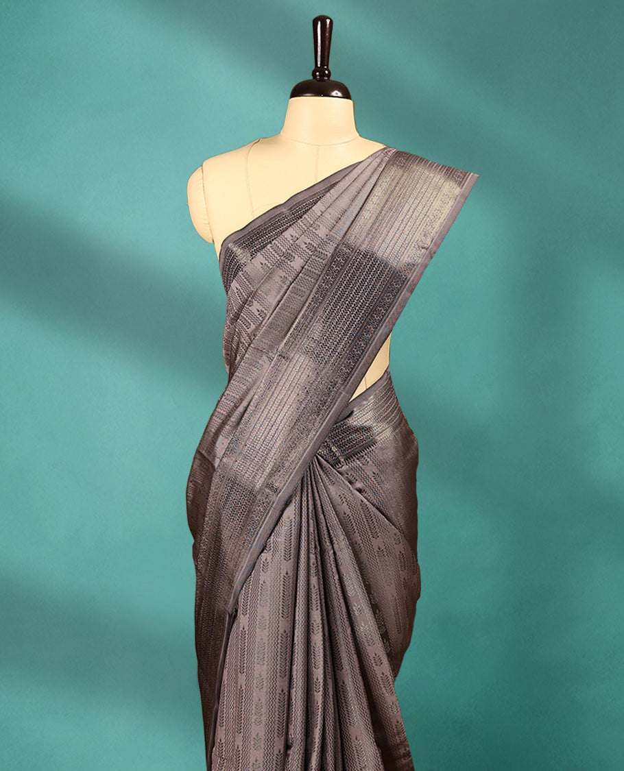 Metallic Beige Art Soft Silk Saree showcases intricate silver zari work on the body and border, paired with a matching blouse