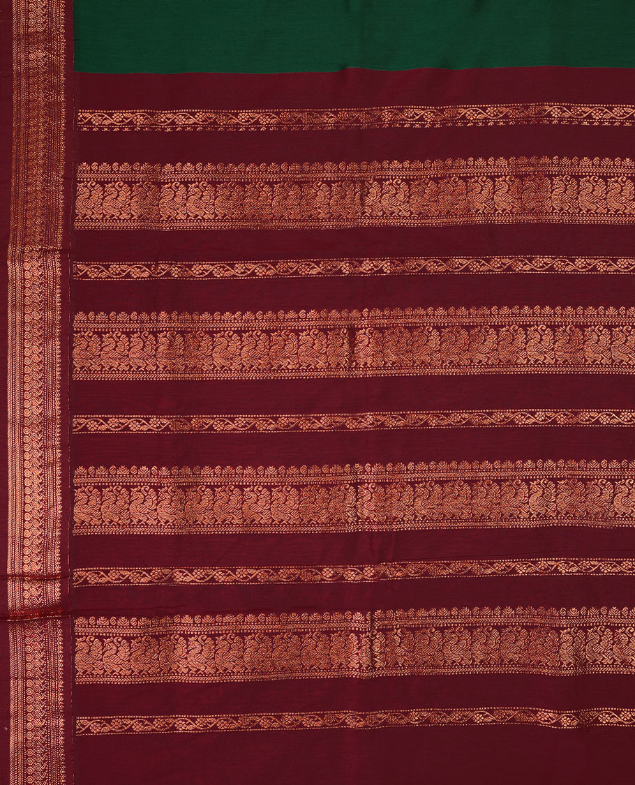 Bottle Green colour mixed Kalyani cotton saree featuring Copper zari Mango motifs throughout the body, paired with a Maroon colour traditional border and pallu, with matching blouse