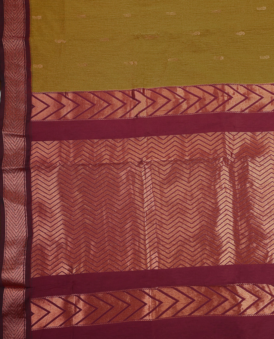 Sand yellow and Maroon Kalyani cotton saree featuring small woven motifs on the body, highlighted with rich zigzag and geometric zari patterns on the border and pallu, paired with a matching blouse.