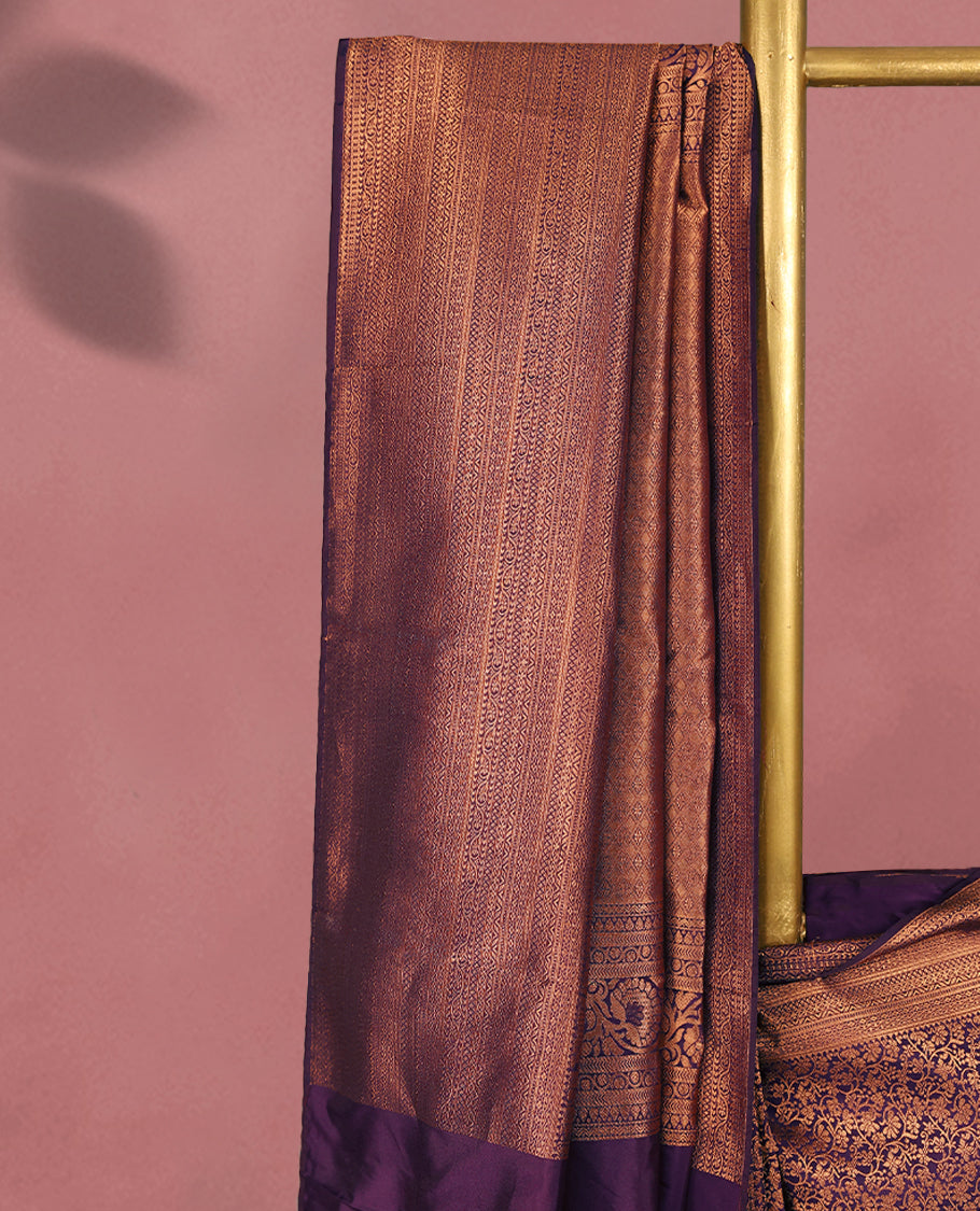 Royal Purple colour Kancheepuram saree featuring an antique zari brocade body, complemented by a traditional border and a matching blouse.