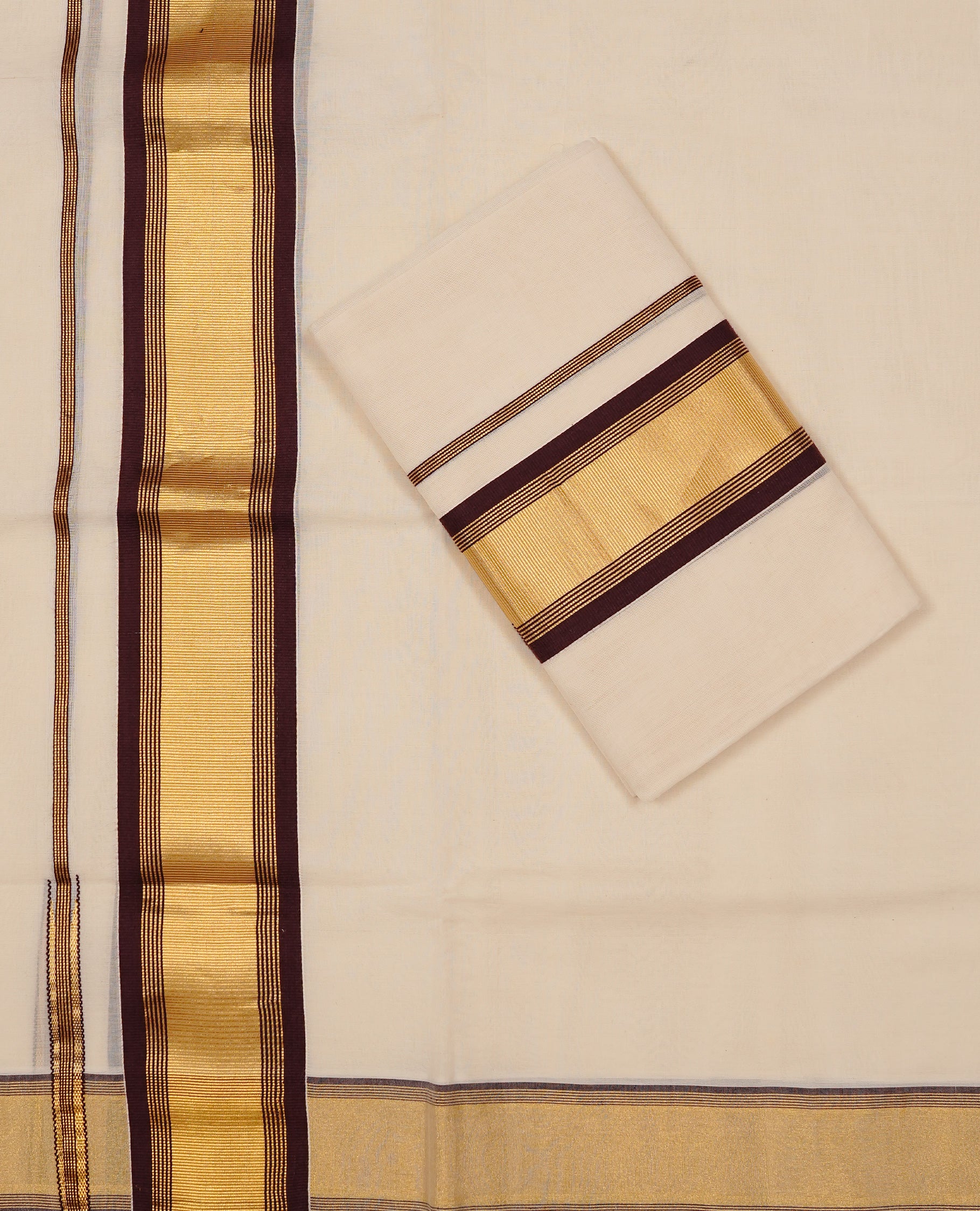 Off white colour Cotton Set Mund featuring a plain body, enhanced by a gold zari border with chocolate brown stripes.