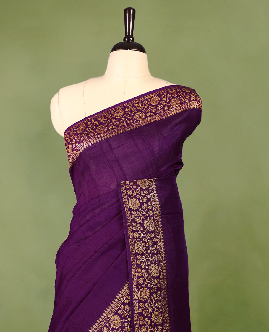 Purple colour Tussar Banaras saree featuring a plain body, rich floral woven zari border and grand pallu, paired with a matching blouse for an elegant and regal traditional look.