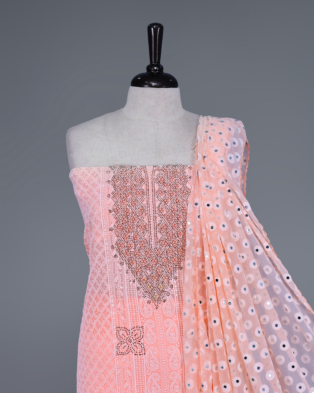 Peach Colour Georgette Salwar Material featuring elegant Chikankari work on the kurta, paired with a matching bottom and a sequins-embellished dupatta.
