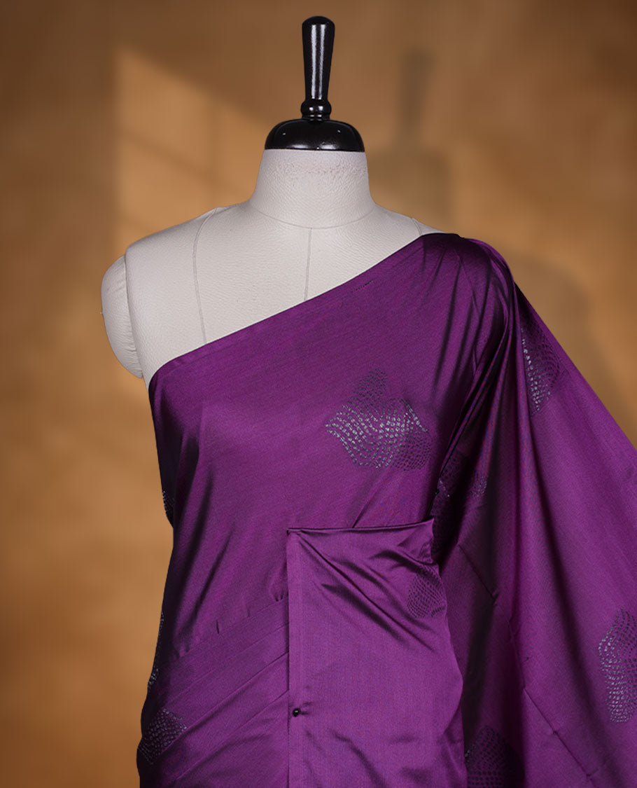 Purple colour semi soft silk saree adorned with delicate woven motifs on the body, complemented by a Self colour woven pallu with intricate detailing and tassel accents without border & Comes with a matching blouse piece.