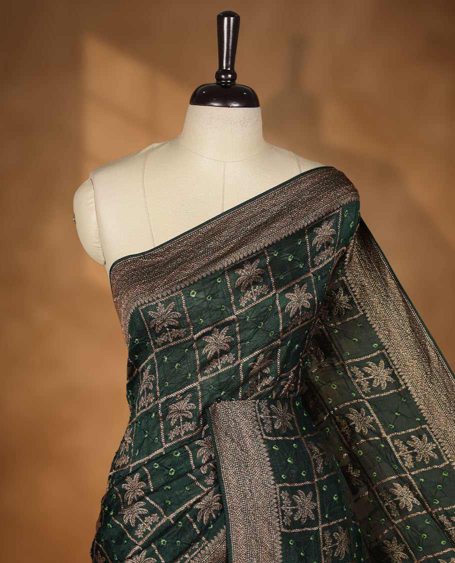 Deep Green colour Banarasi Bandhani silk saree featuring with intricate Banarasi motifs on body, complemented by antique zari woven border and grand pallu, paired with matching blouse