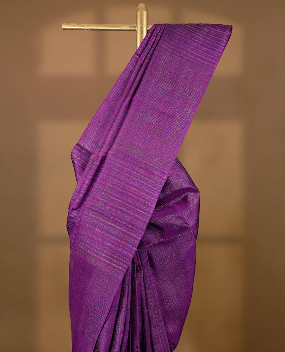 Violet coloured Manthrakodi saree featuring a multicoloured zari jacquard body, complemented by a self coloured turning Banarasi border and a matching self coloured blouse.