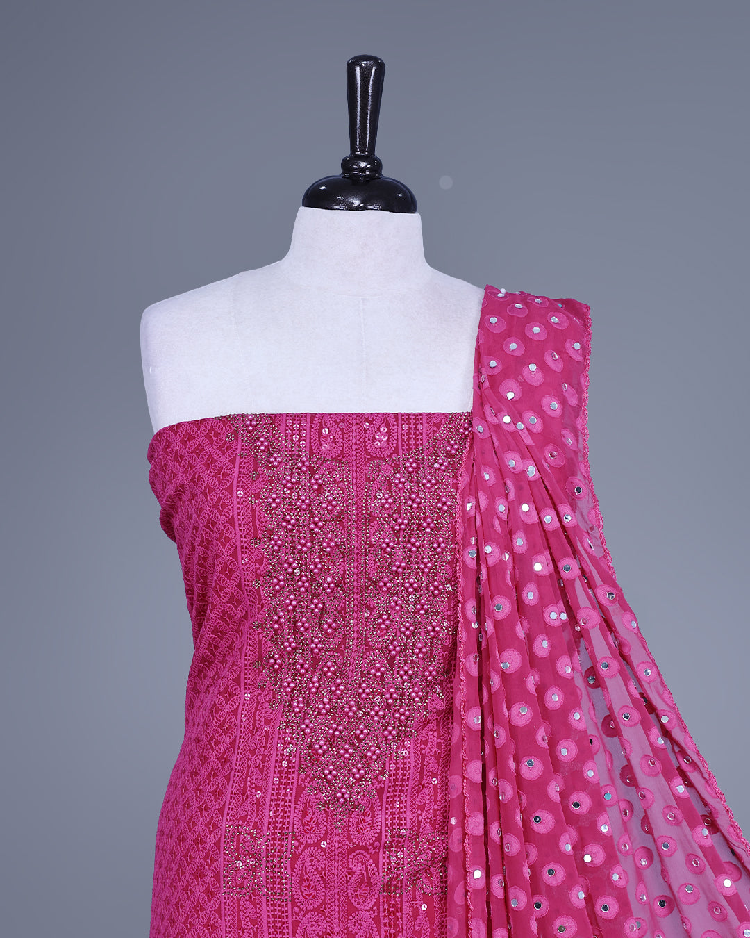 Magenta Colour Georgette Salwar Material featuring elegant Chikankari work on the kurta, paired with a matching bottom and a sequins-embellished dupatta.