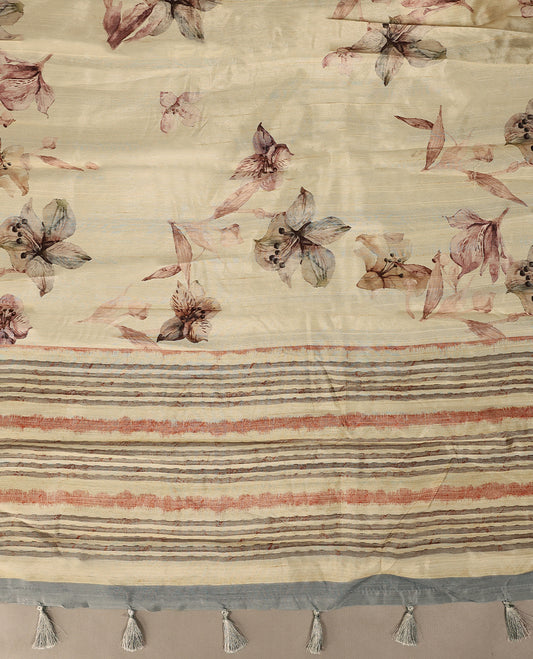 Cream colour semi silk printed saree adorned with pastel onion floral motifs across the body, finished with a light Blue and light Brown striped border, with matching blouse