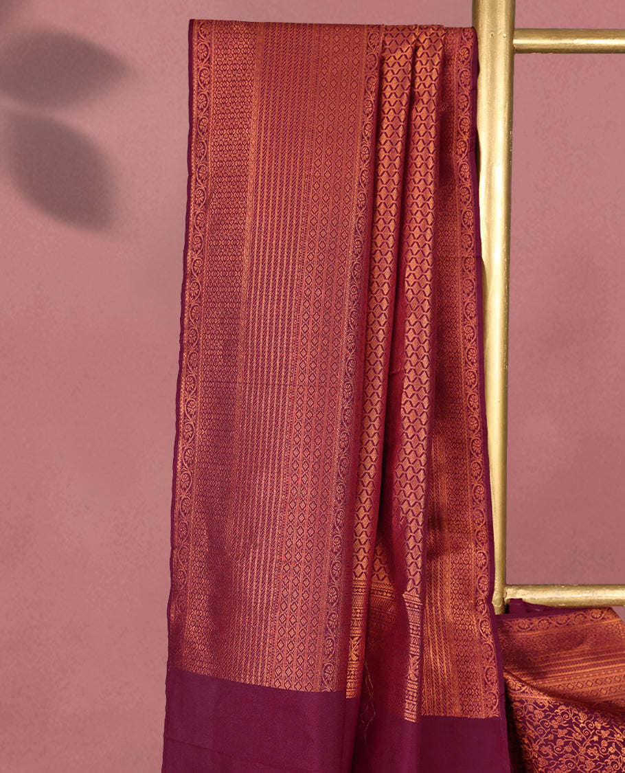 Bordeaux colour Kancheepuram saree featuring an antique zari brocade body, complemented by a traditional border and a matching blouse.
