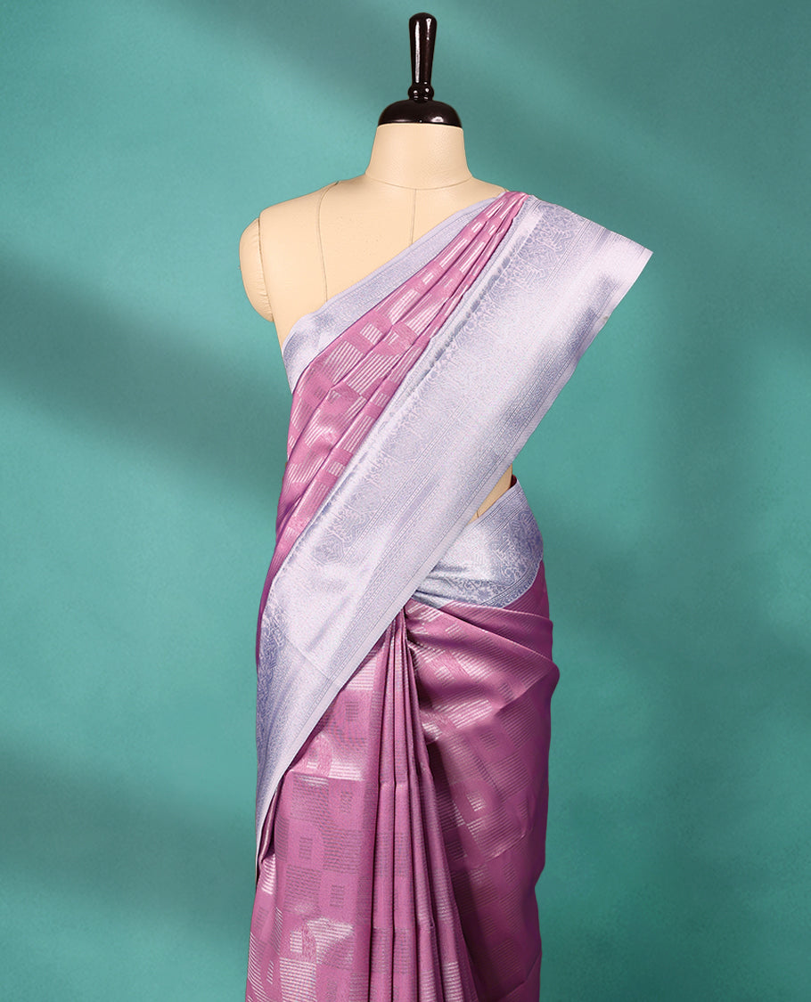 Pastel Pink coloured semi silk saree featuring a Zari design on the body, paired with a Baby Blue coloured border and matching blouse.