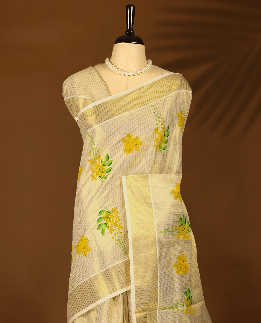 Kerala tissue saree with bright yellow floral motifs and a soft golden Border with Matching Blouse