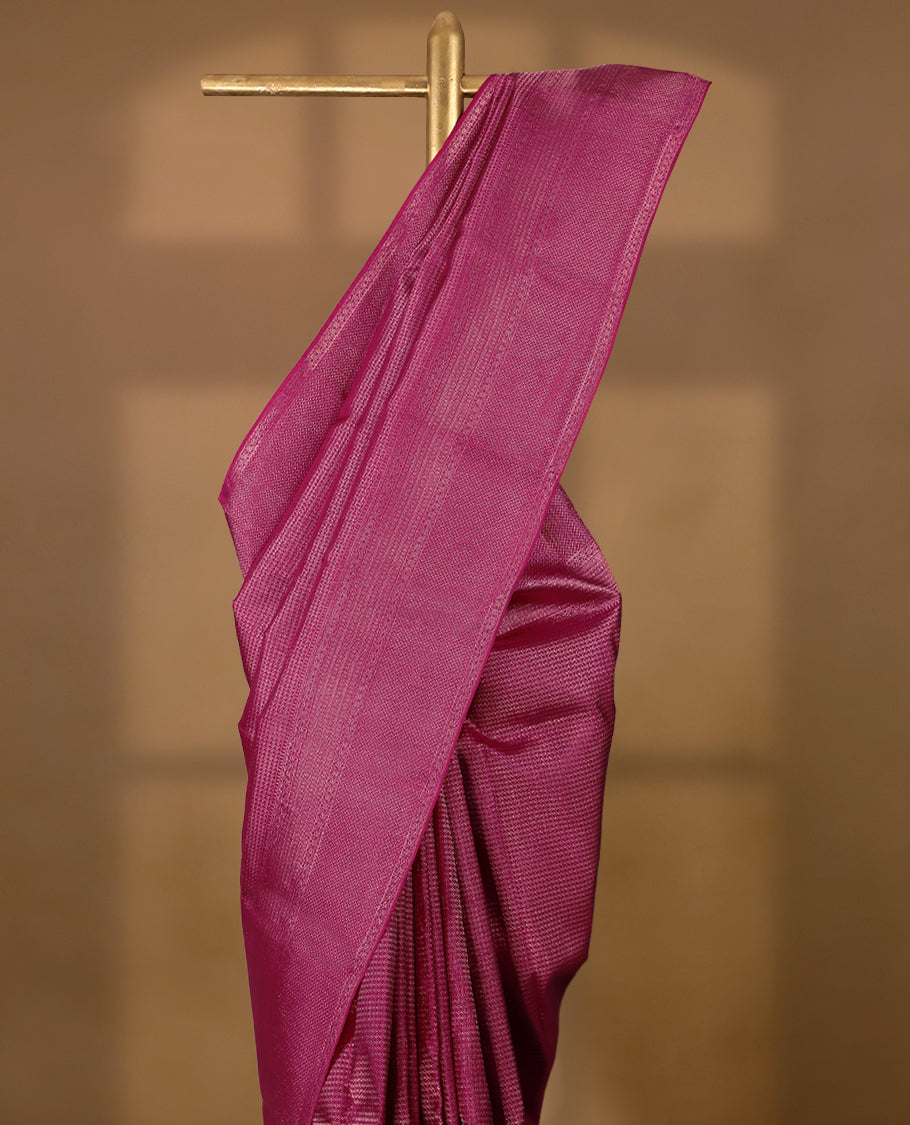 Dark pink Colour Manthrakodi saree featuring an antique zari brocade pattern on the body, complemented by a traditional Laddu Kamalam brocade border and a matching brocade blouse.