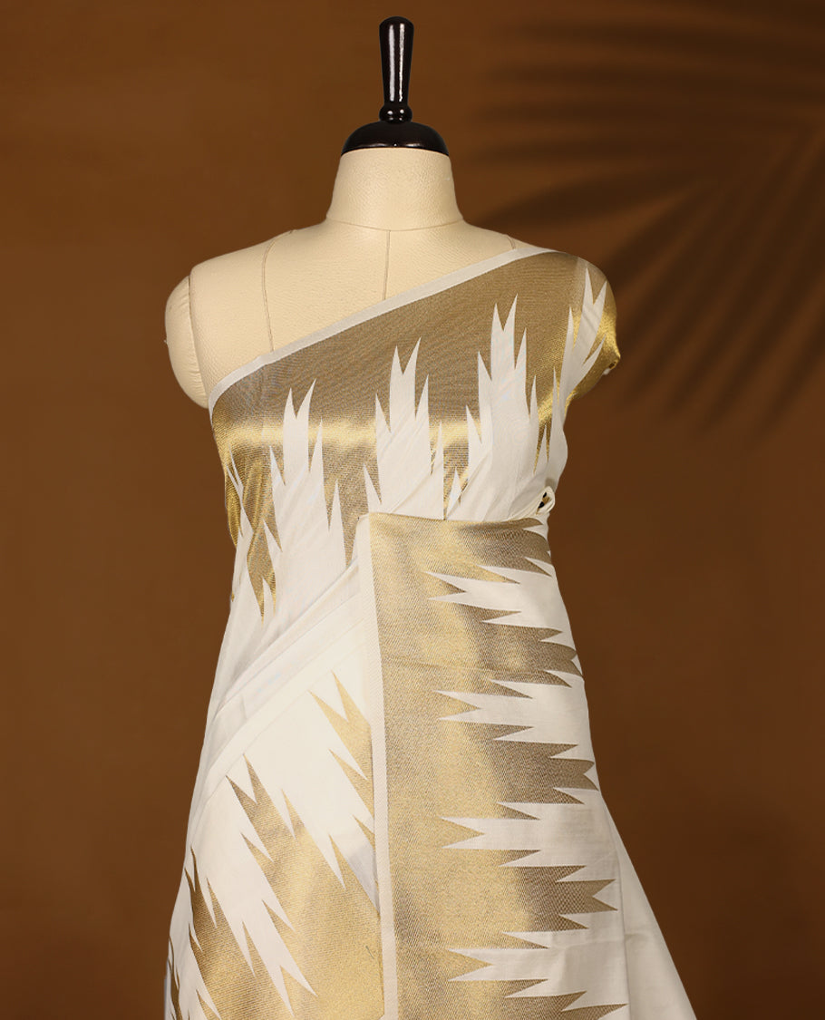 Elegant white colour sotf Tussar Kerala saree featuring Plain body, Gold kasavu Rich Temple border, Paired with matching blouse offering a classic and graceful look