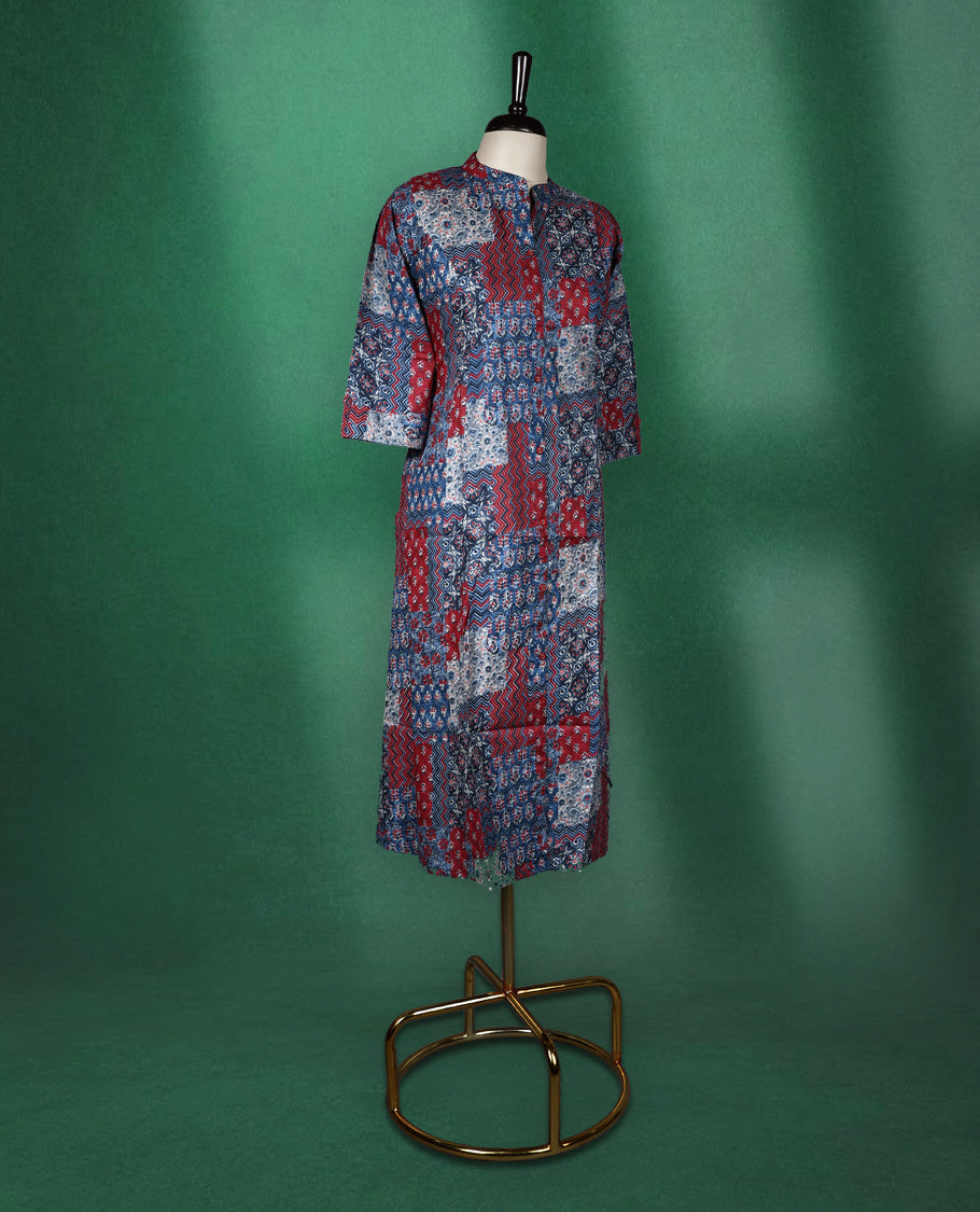 Multicolour colour kurti adorned with vibrant patchwork style prints in shades of red, blue, and white, featuring a mandarin collar, front placket, and three quarter sleeves a bold and comfortable choice for everyday fashion.