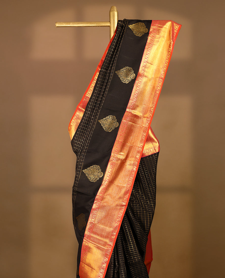 Black Colour pure traditional Kancheepuram silk saree featuring antique zari check designs on the body, complemented by a traditional contrast coloured border and a matching contrast blouse.