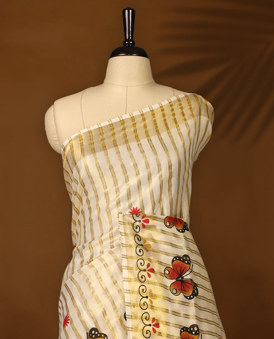 Elegant off white tissue Kerala saree featuring golden stripes and vibrant orange butterfly motifs, enhanced with a traditional golden zari border, offering a graceful and artistic look, paired with a matching blouse.