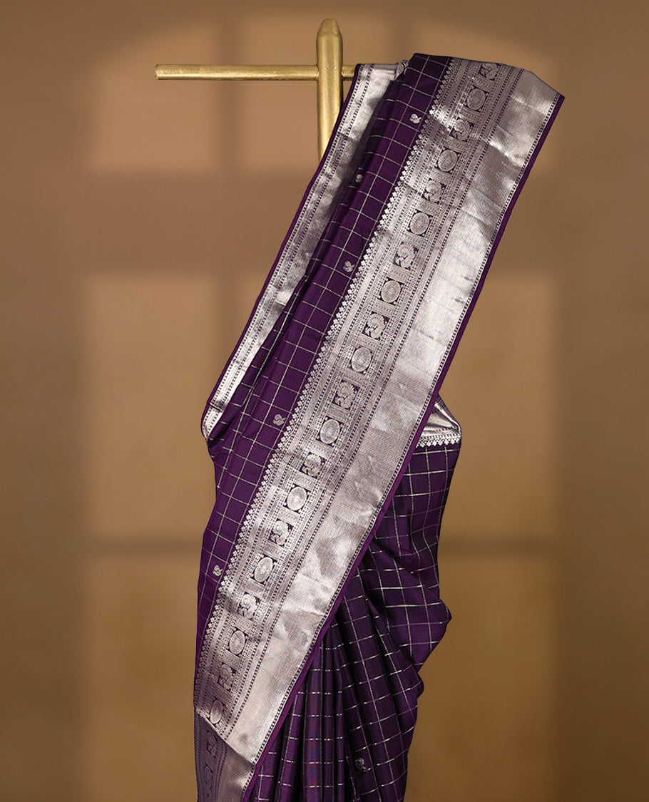 Royal Purple traditional Kancheepuram silk saree featuring antique zari check patterns with peacock and chakkram motifs on the body, a coordinated peacock and chakkram design on the border, and a matching Contrast blouse.