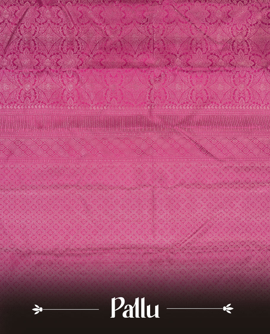 Magenta colour Kanchipuram pattern Manthrakodi saree adorned with antique copper zari floral creeper design featuring traditional peacock and elephant motifs, complemented by a rich zari jacquard border and blouse piece.