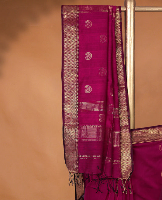 Deep Magenta colour Maheshwari Cotton saree featuring Antique Zari Mango Patterns across the entire body, complemented by a traditional Gold Zari border & Pallu, with a matching blouse.