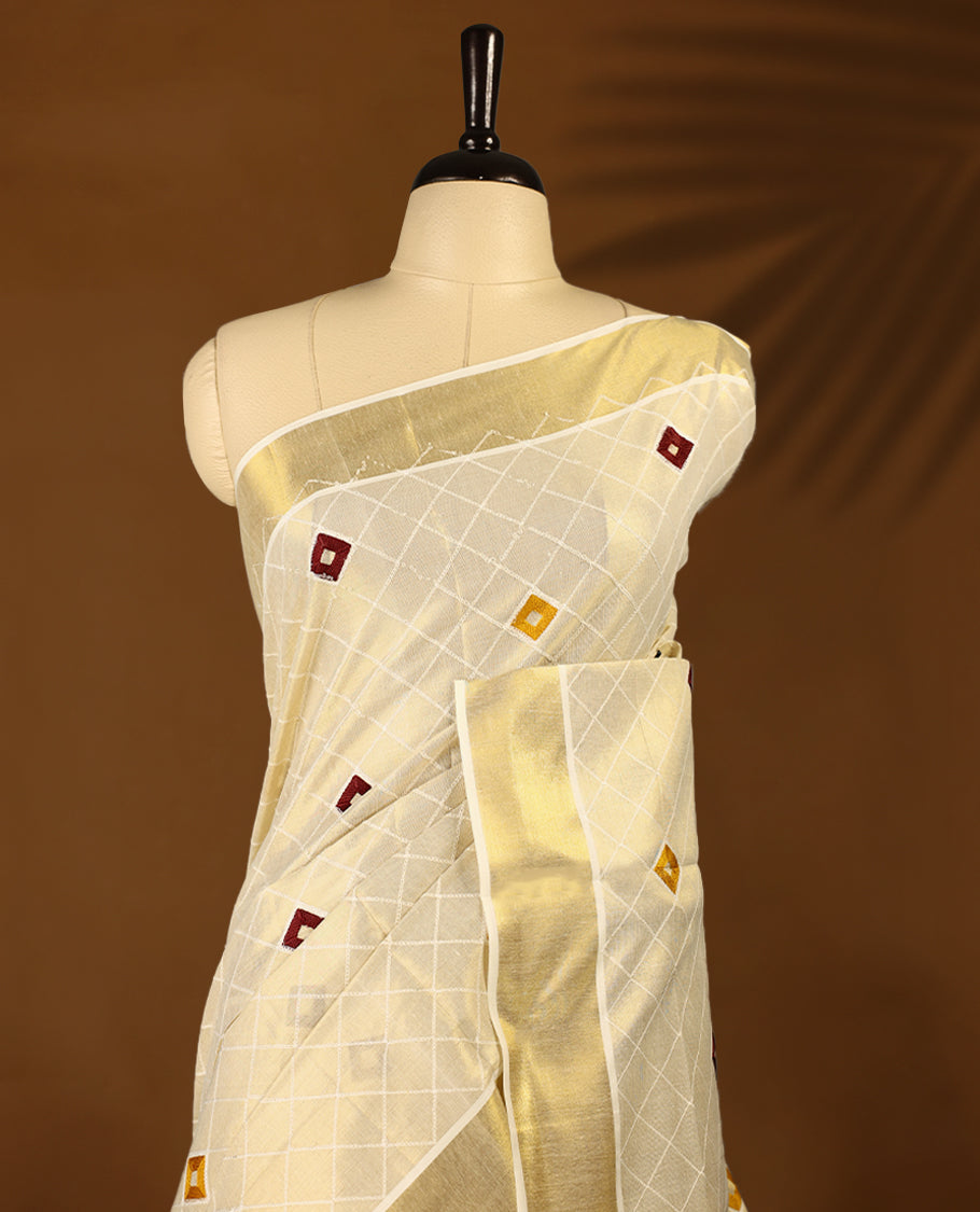 Light Gold colour Tissue Kerala saree featuring thread diamond work on body and a beautifully woven Gold Kasavu border, paired with a matching blouse perfect for festive occasions.