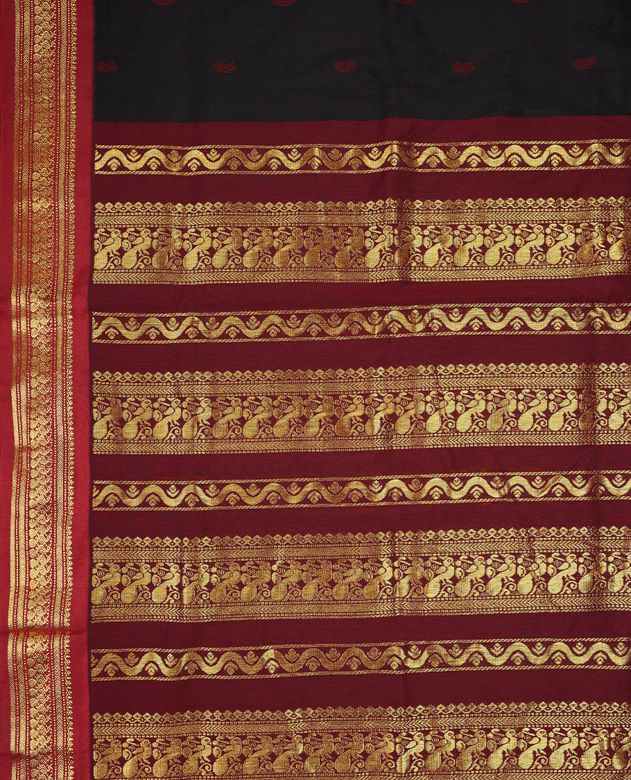 Pure Black colour mixed Kalyani cotton saree featuring Maroon zari motifs throughout the body, paired with a Maroon colour traditional border and pallu, with matching blouse