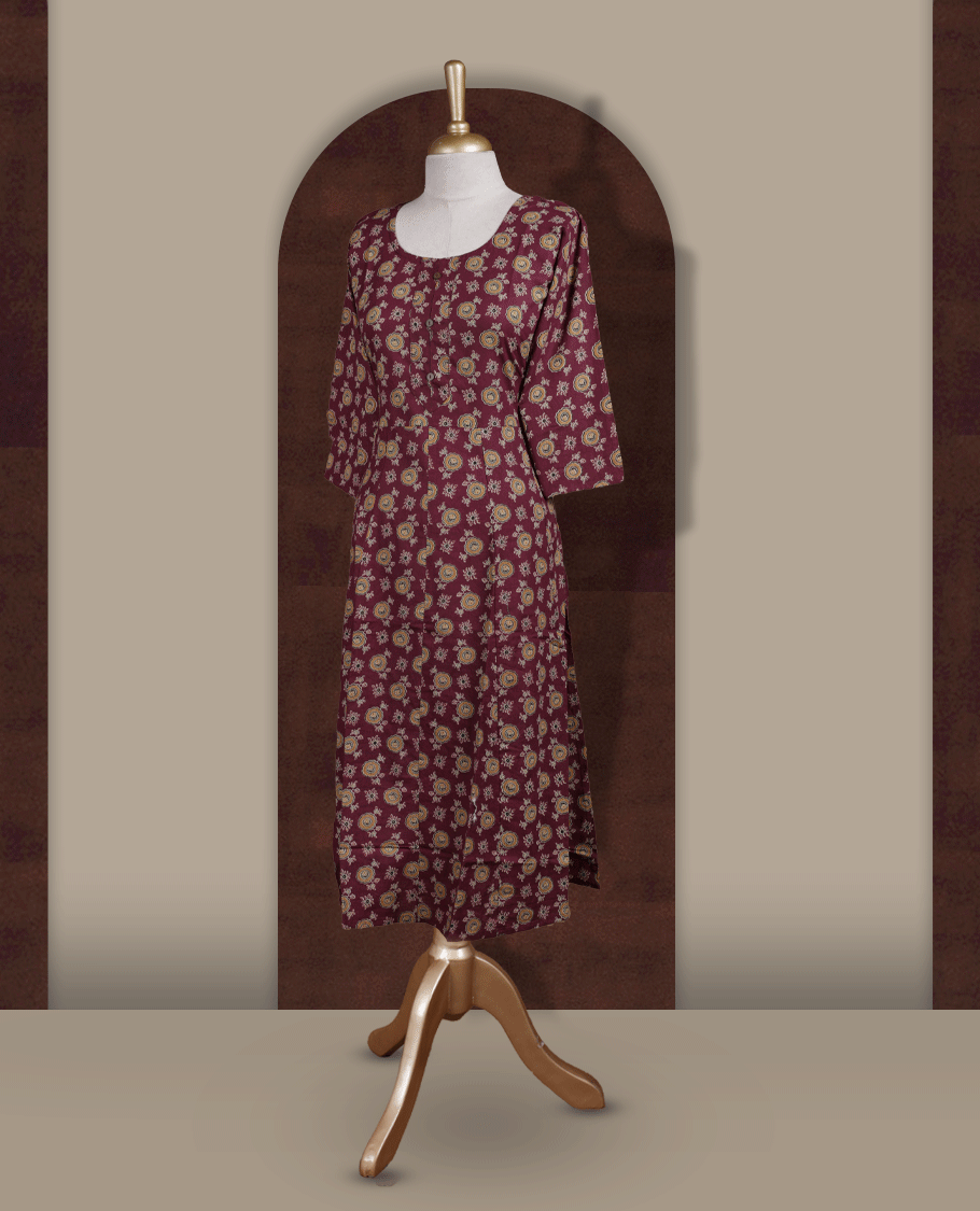 Grape colour kurthi adorned with floral prints, featuring a classic round neckline with front buttons and comfy 3/4th sleeves.