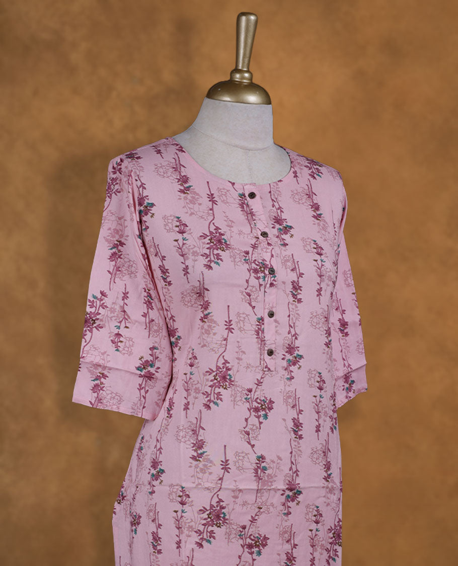 Blush pink colour kurti from TWARA, scattered with dainty floral vines all over, featuring a scoop neckline with button placket and comfy 3/4th sleeves.