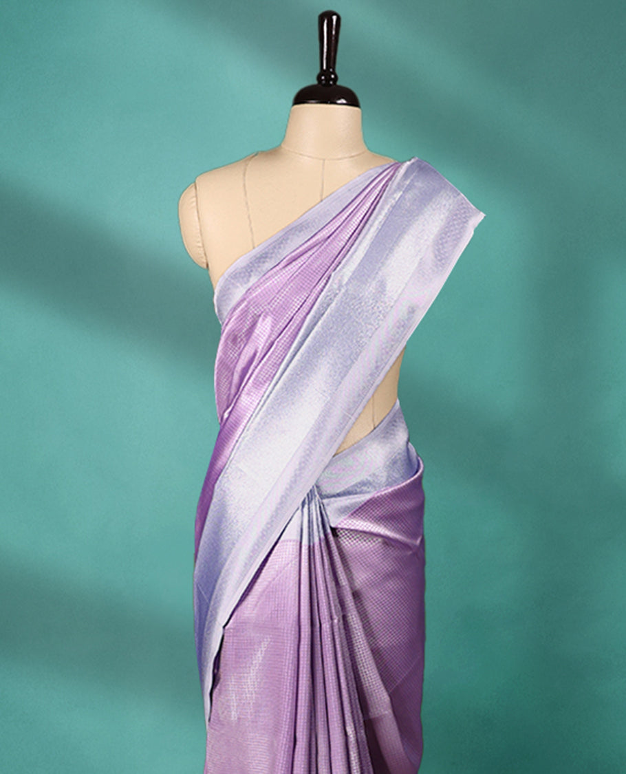 Violet coloured semi silk saree featuring a Check design on the body, paired with a Baby Blue coloured border and matching blouse.