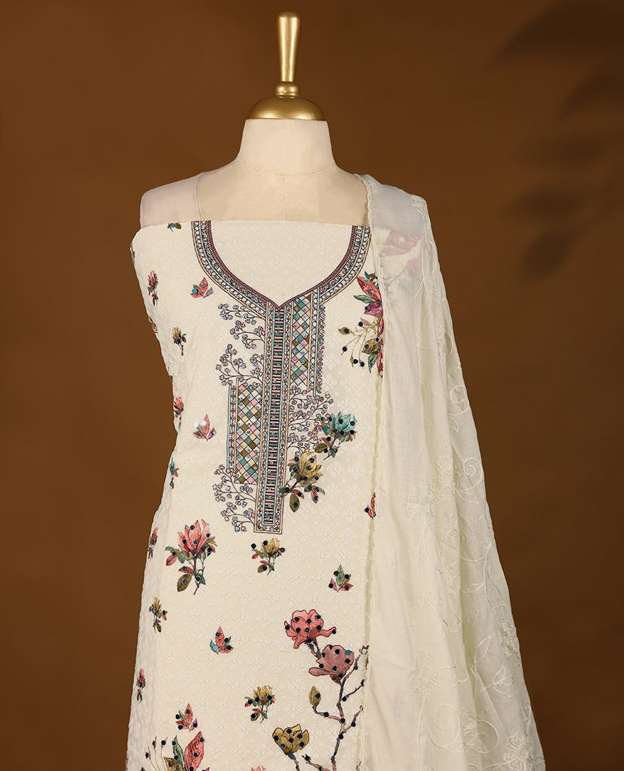 Off-white ensemble featuring a hand-embroidered top with intricate threadwork, paired with matching bottoms and a worked dupatta.