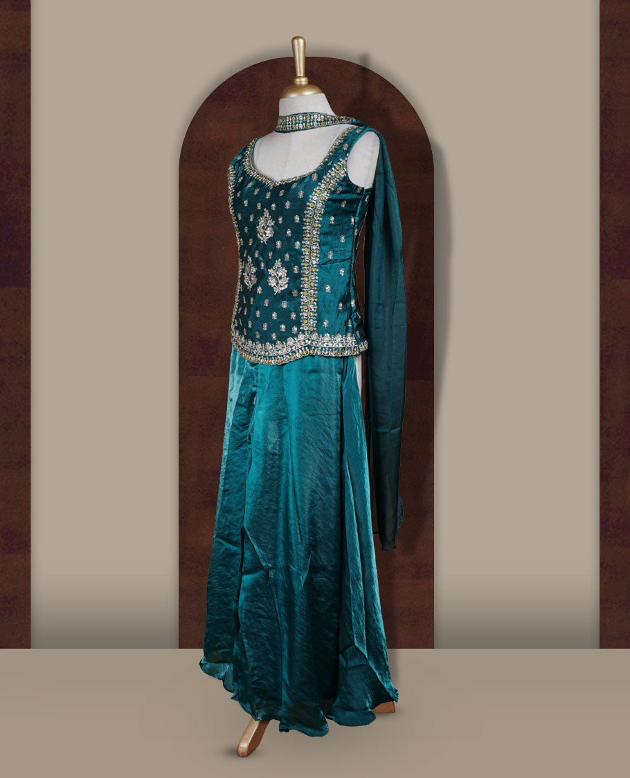 Rich peacock green colour sharara set adorned with intricate light golden embroidery and sequins work & The fitted embellished top pairs beautifully with the flared bottoms and matching dupatta.
