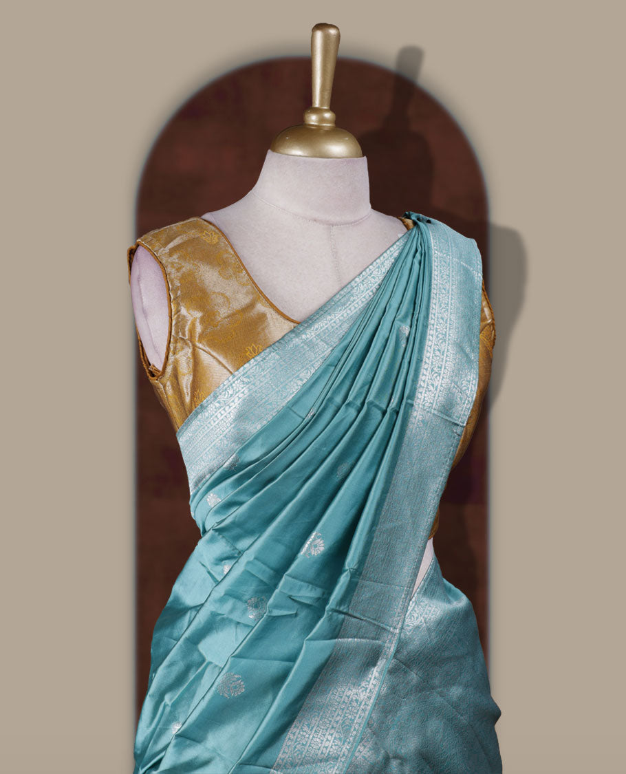 Ocean blue and mustard colour Dhavani set featuring a Mustard colour skirt with contrast ocean blue colour border with rich silver zari pattern & stone work, paired with a contrasting ocean blue dupatta detailed with silver motifs