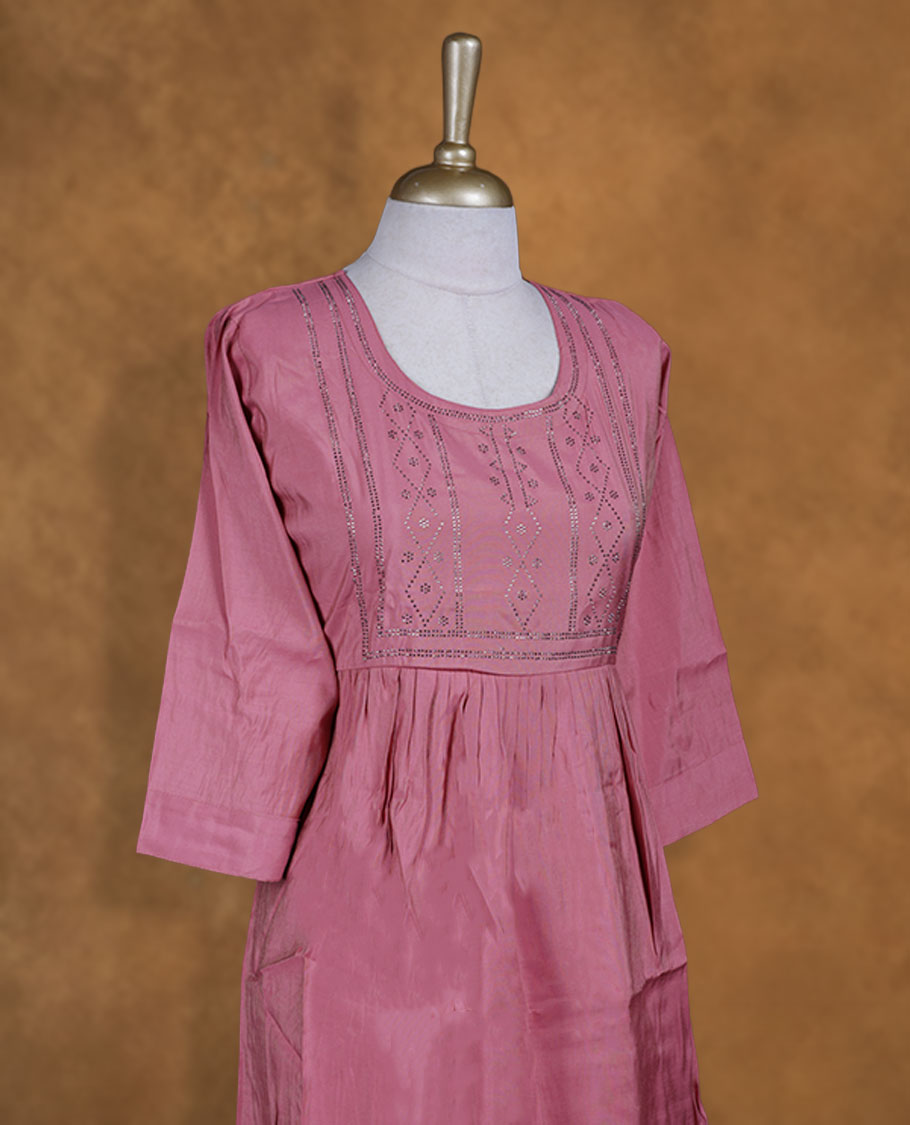 Pastel pink colour kurti with white stone pattern, knee length design, styled with a Round neckline and a sleeve .
